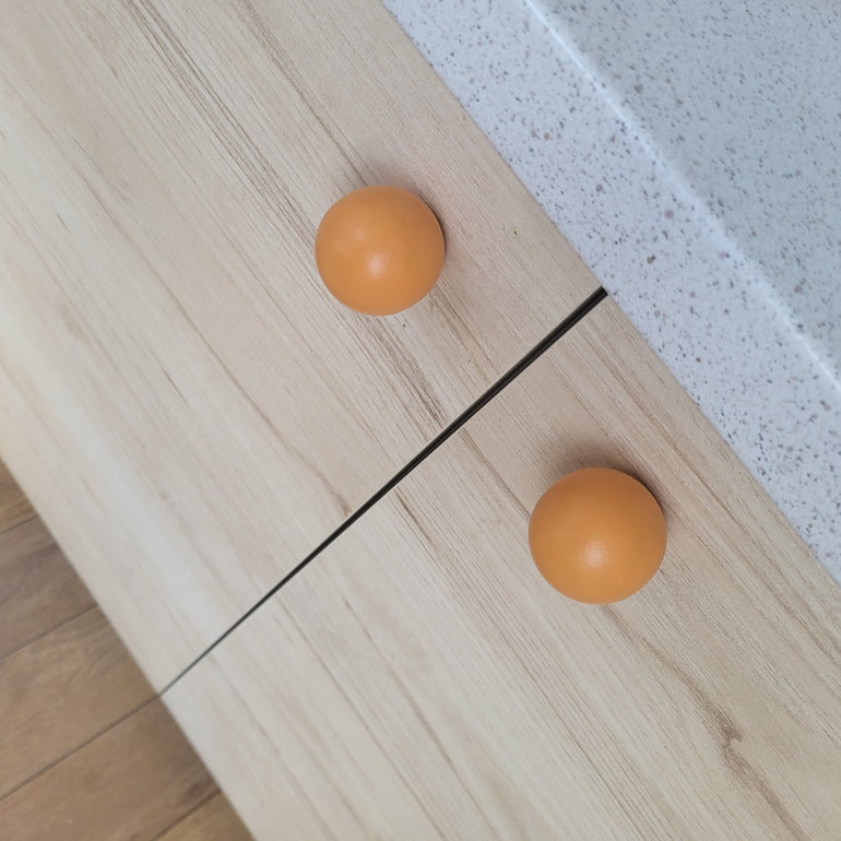 Orange cabinet knobs