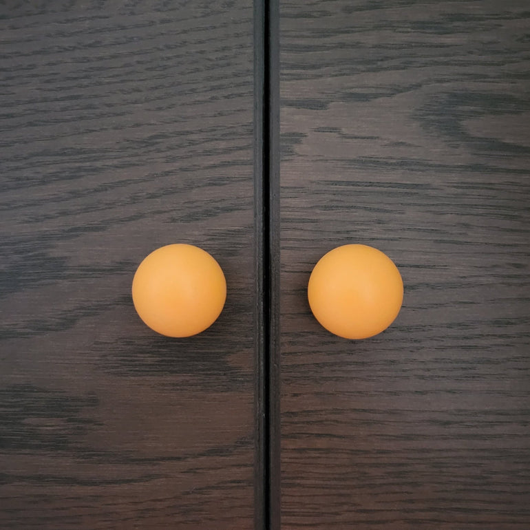 Orange furniture knobs