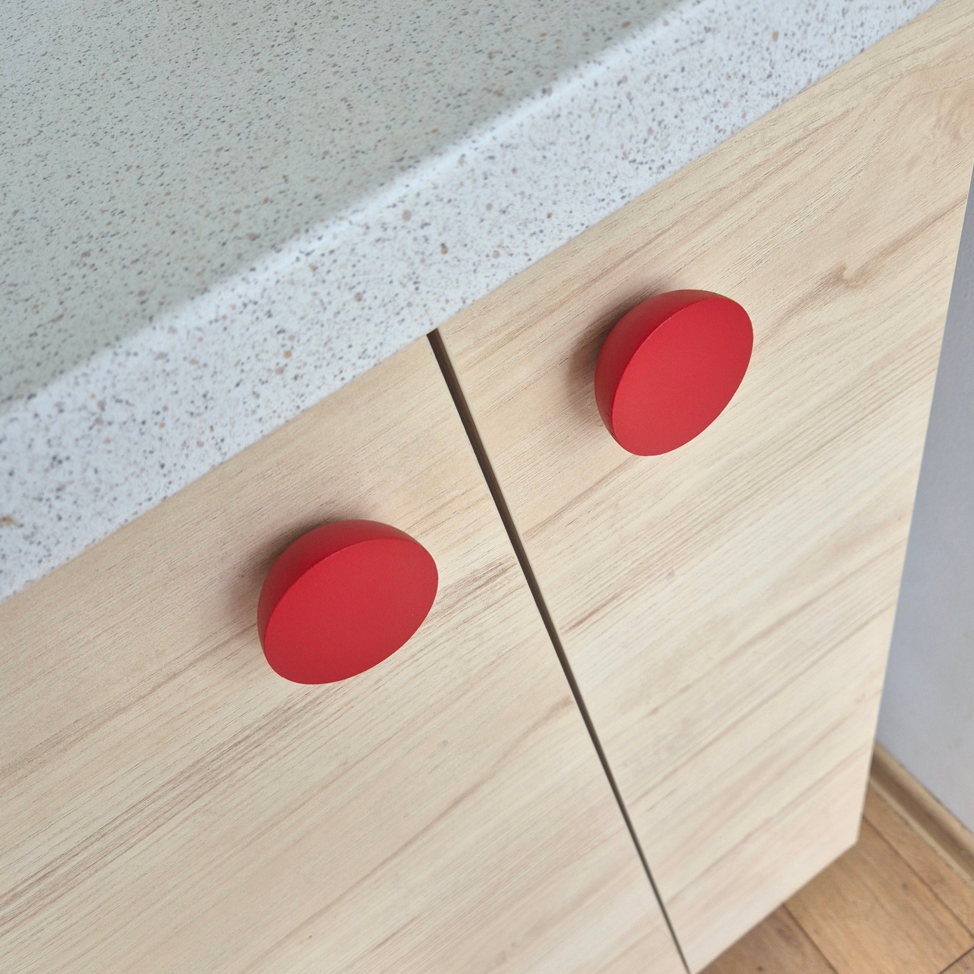 Playful red knobs for children room furniture