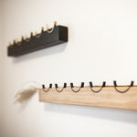 Black and oak wood wall racks