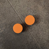 Orange round flat cabinet knobs